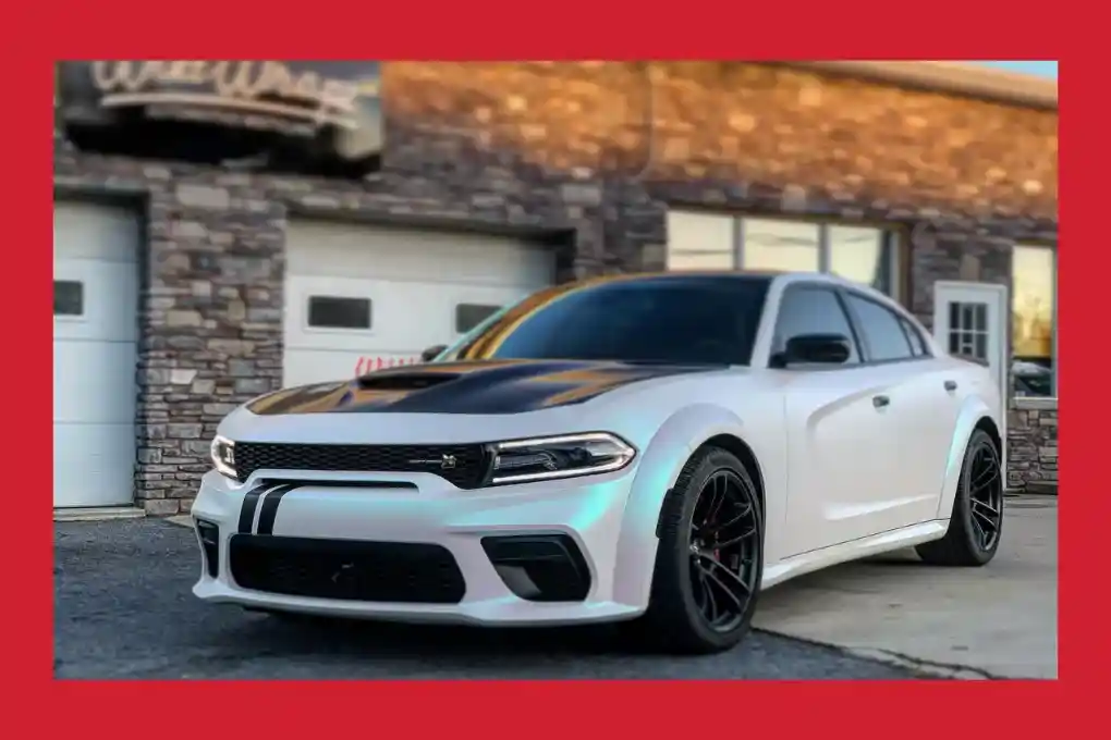 A sleek Dodge Charger SRT Hellcat parked, showcasing its aggressive design and powerful stance.